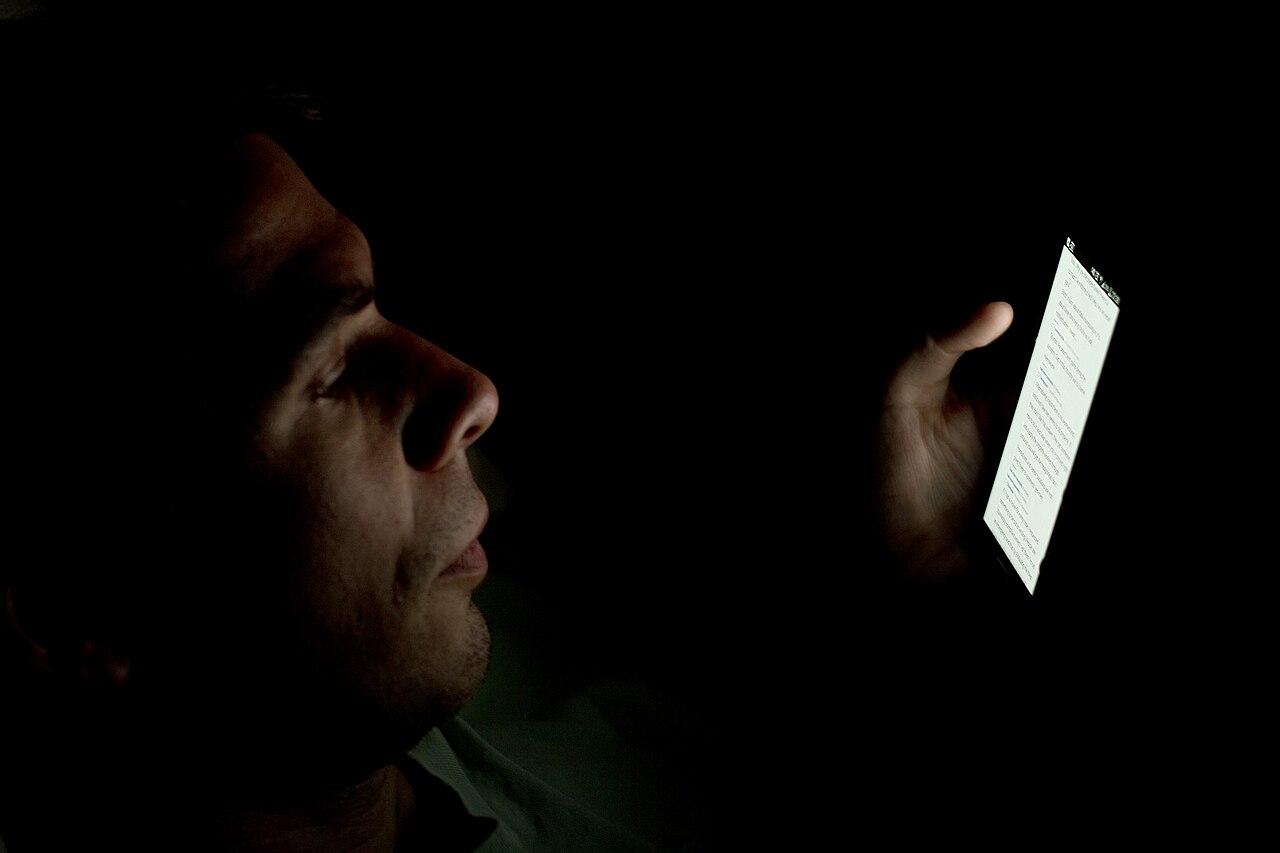 Person looking at smartphone in the dark 2